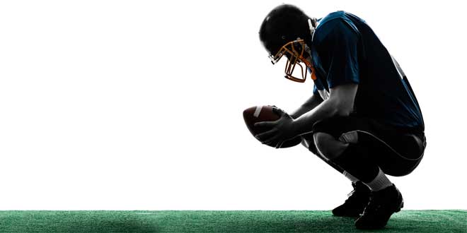 Rugby player holding a ballon Rugby player holding a ballon