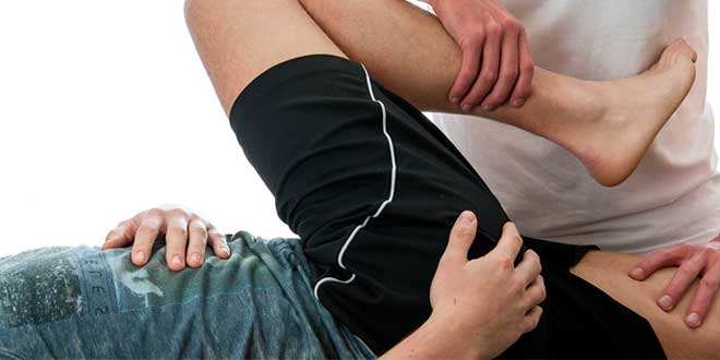 A person holding another's leg