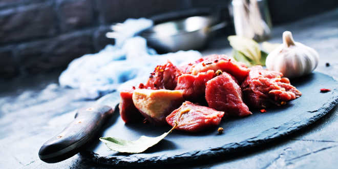 Dish of raw meat, garlic and bay