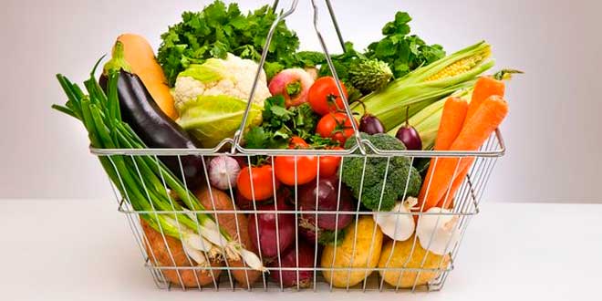 A basket with fresh vegetables and fruit A basket with fresh vegetables and fruit