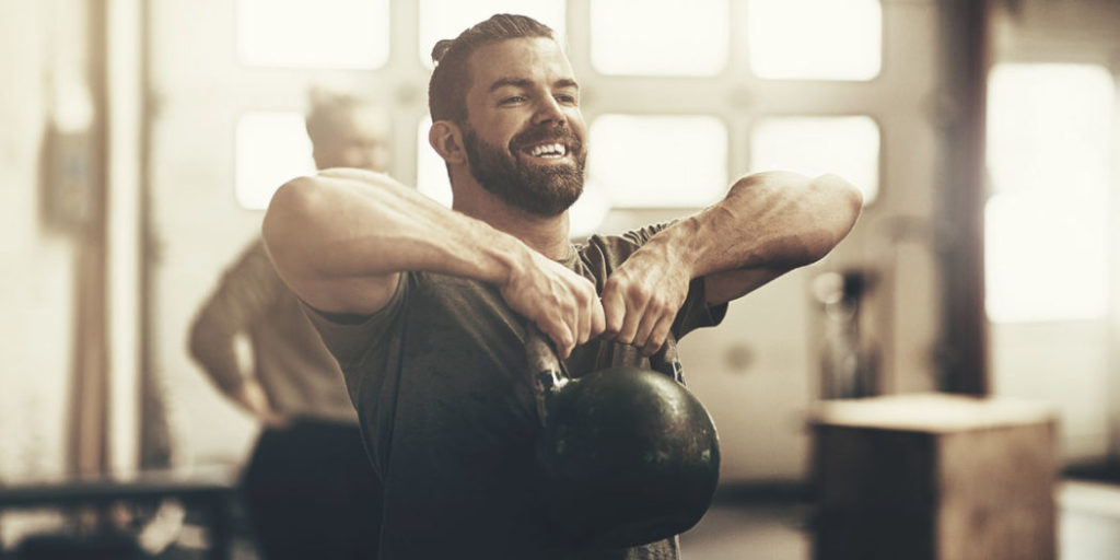Man lifting a kettlebell