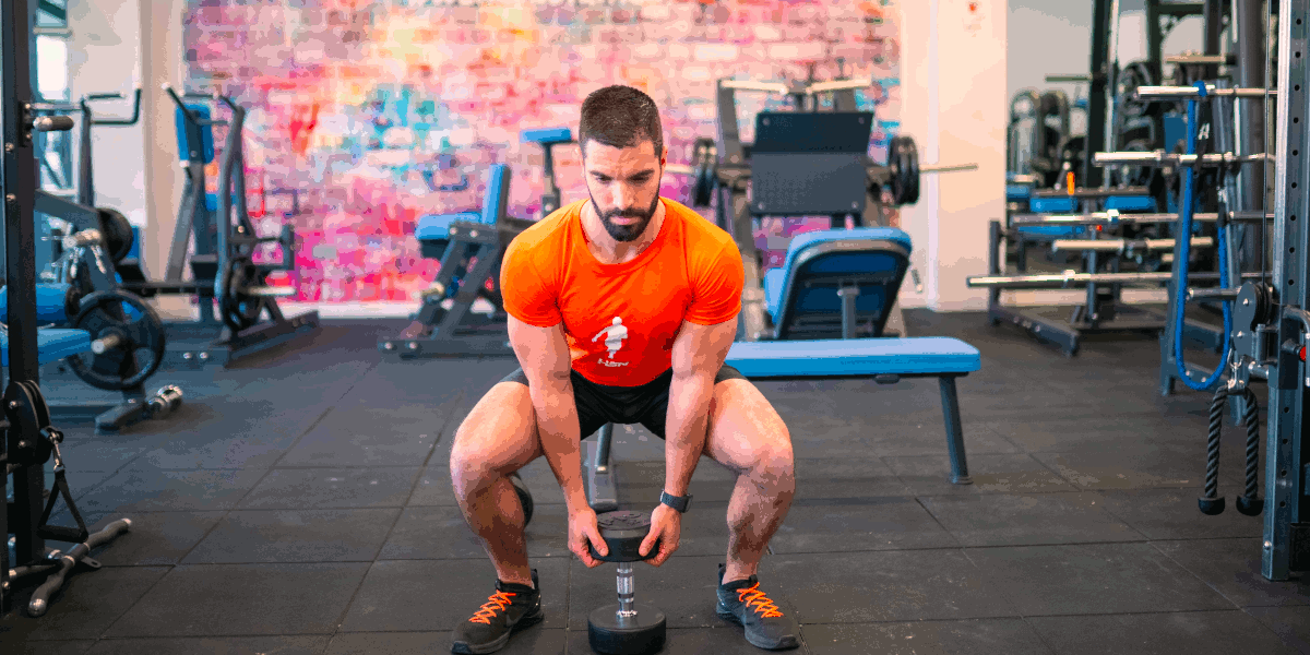 squats-with-dumbbell-between-legs squats-with-dumbbell-between-legs