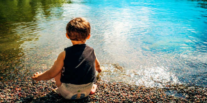 Child on a lake Child on a lake