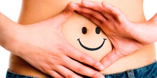 Happy face drawn on a belly