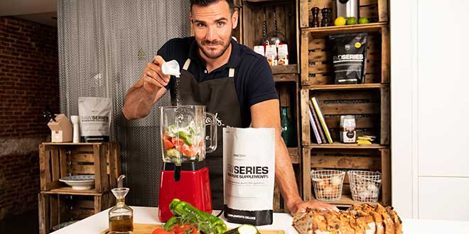 Adding the protein to the blender Adding the protein to the blender