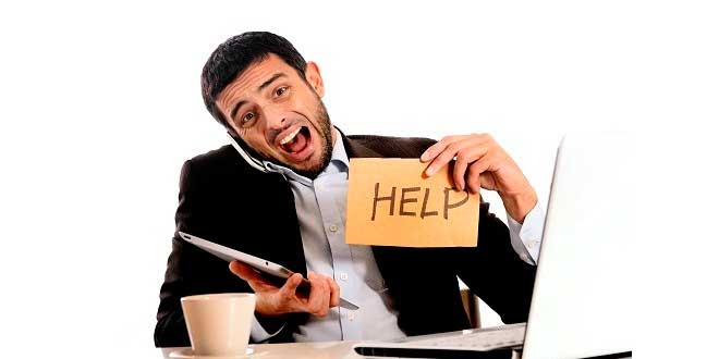 Stressed man holding a HELP sign