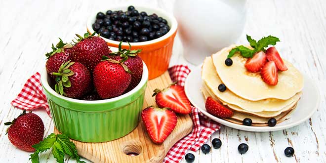 Pancakes with blueberries and strawberries
