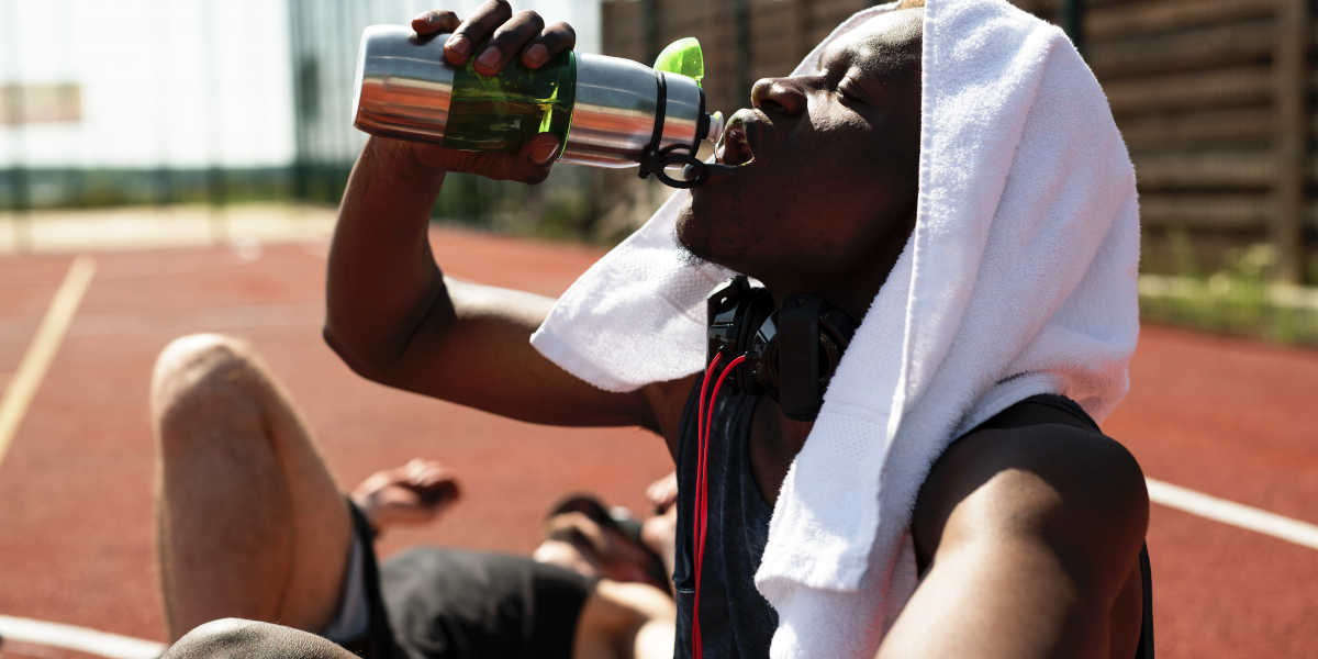 Athlete drinking water Athlete drinking water