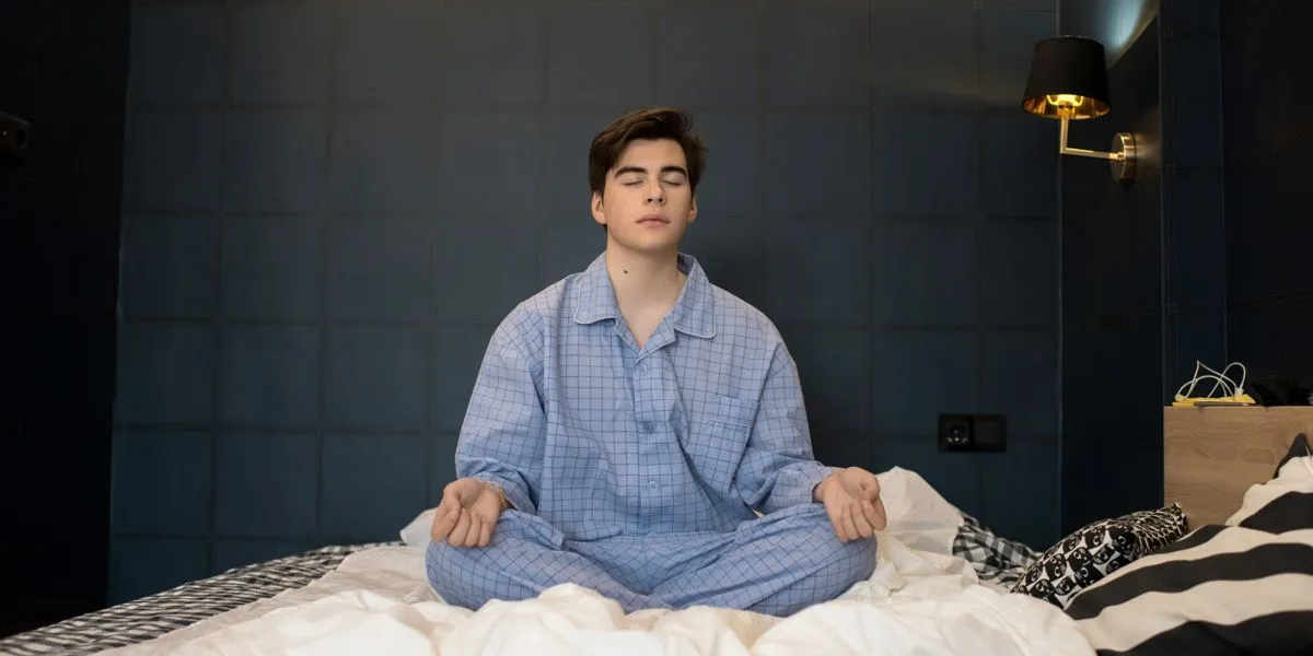 Man meditating before sleeping