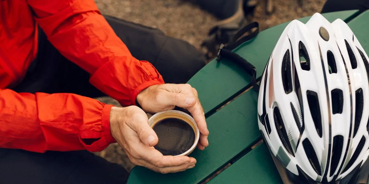 Cyclist drinking coffee