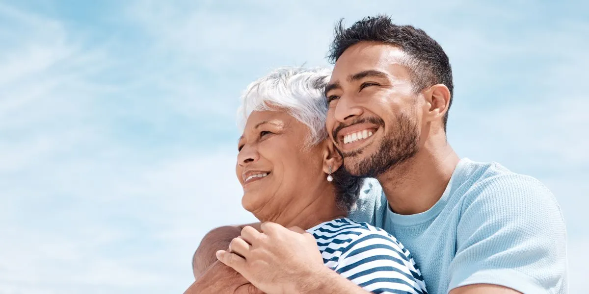 Mother and Son looking at the horizon smiling Mother and Son looking at the horizon smiling