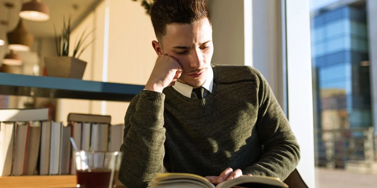 Cultured young man practising active reading