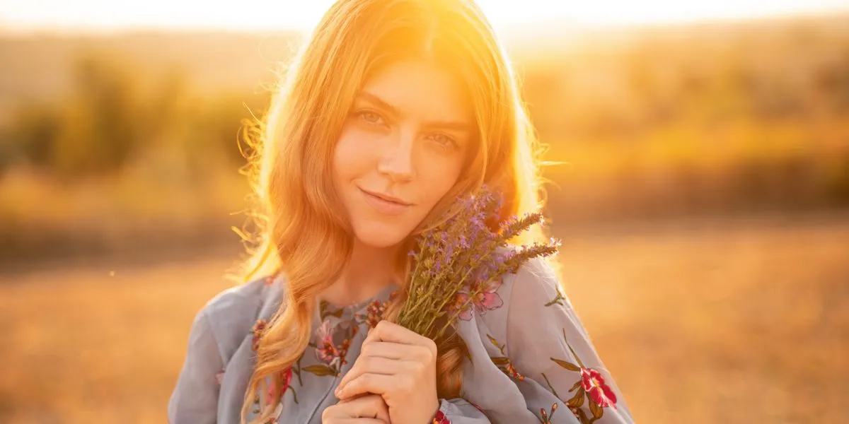 Young woman at sunset in a field