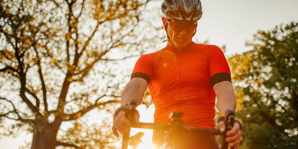 Cyclist taking a break to check the odometer
