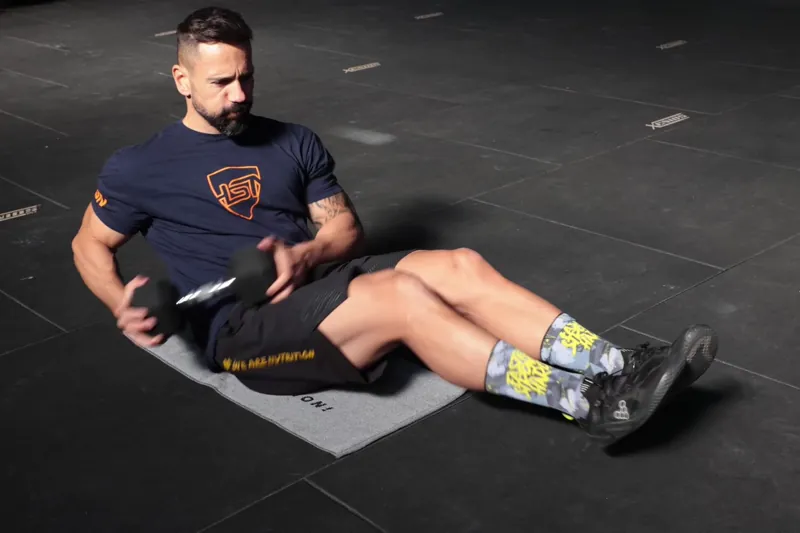Russian twist with a dumbbell